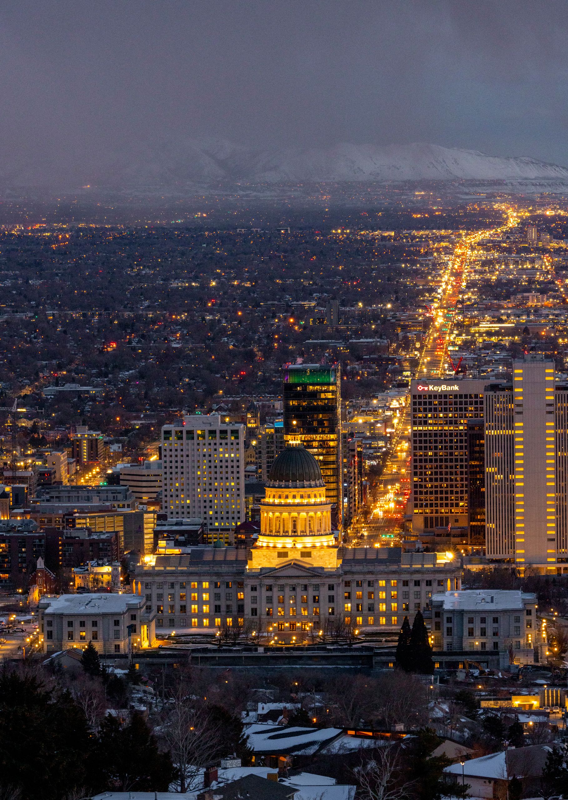 Captivating aerial shot of Salt Lake City's skyline illuminated at night with the Capitol building prominently visible.